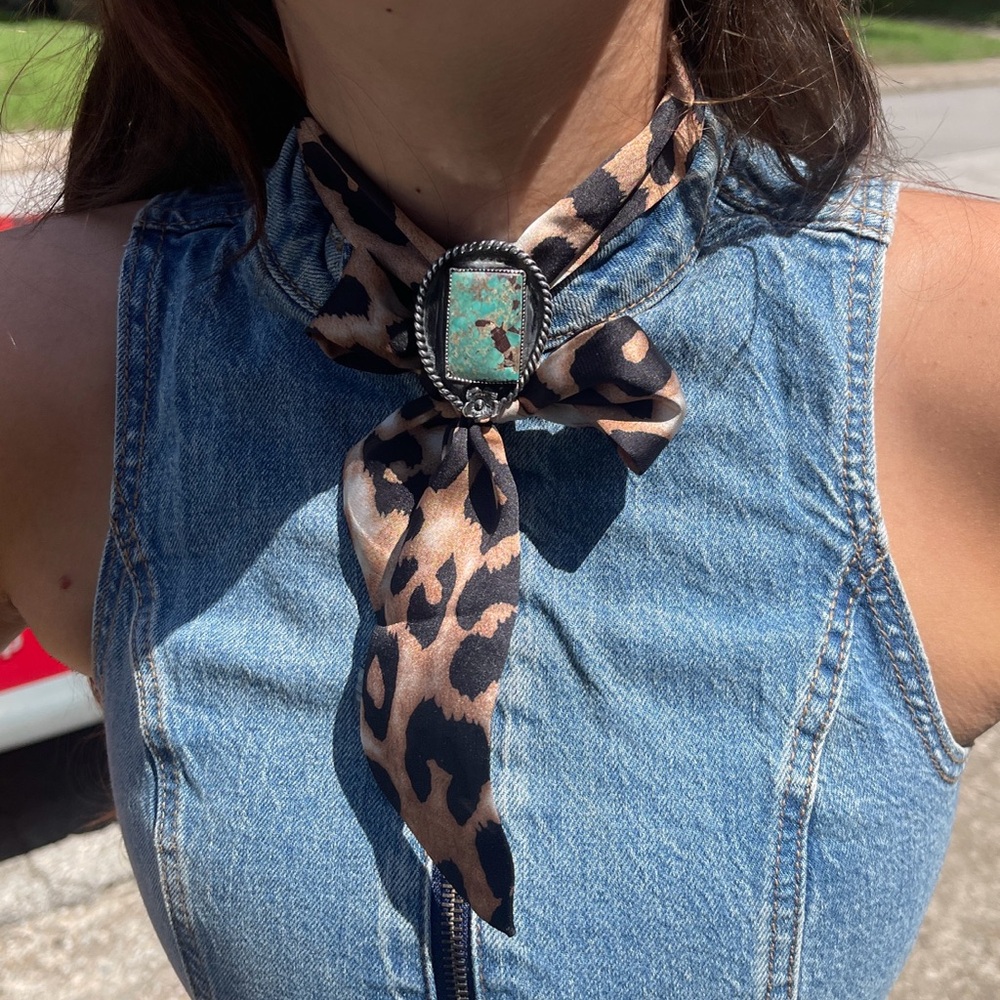 One of a kind handmade genuine turquoise set in .925 sterling silver bolo tie.